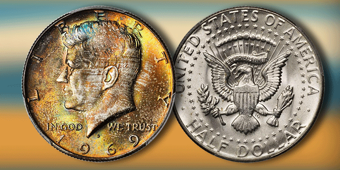 Grading strip showing four 1969-D Kennedy half dollars from worn circulated through gem uncirculated condition